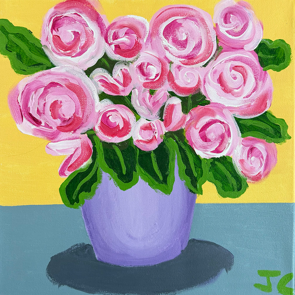 Pink flowers in purple vase