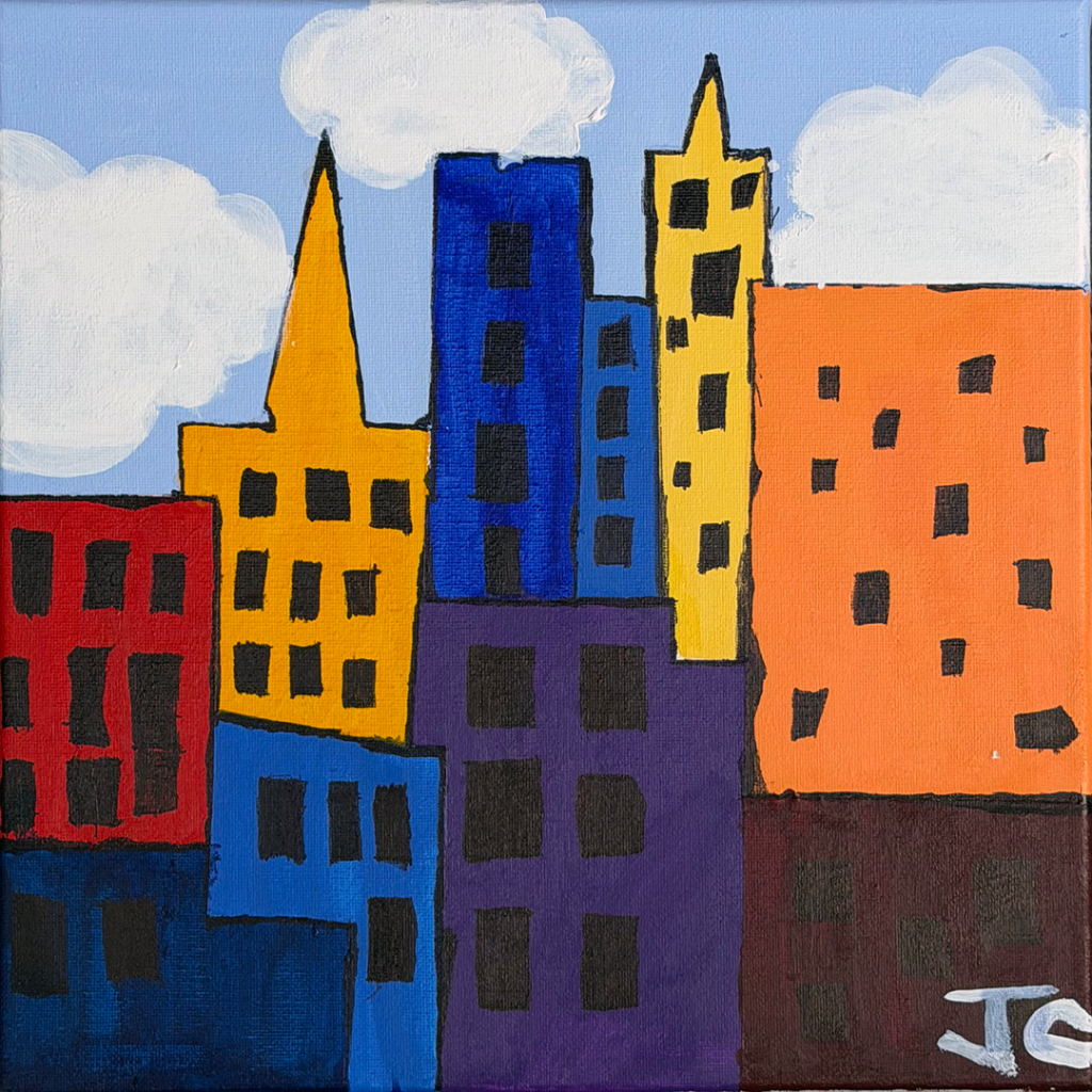 Multcolored buildings in cityscape with blue sky