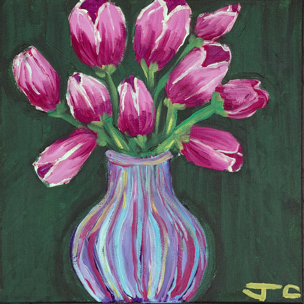 Magenta flowers in striped vase