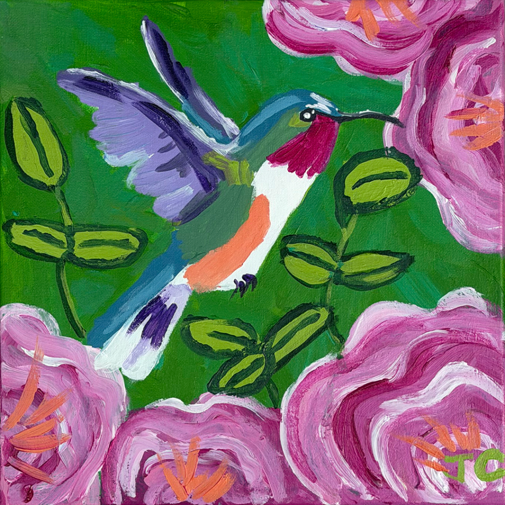 Multicolored hummingbird with pink flowers and green background