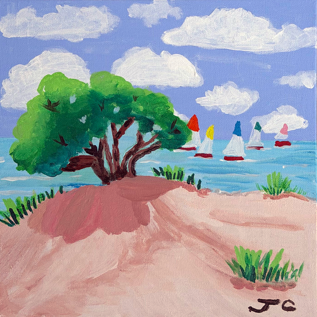 Beach scene with tree and sailboats on horizon